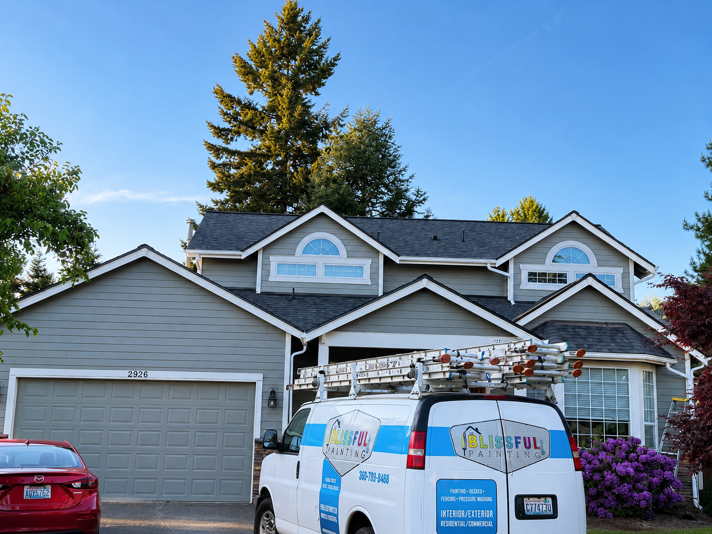 Blissful Painting company van in front of completed residential exterior painting project in Olympia Washington